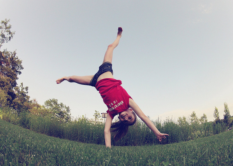 hyper active child doing handstand