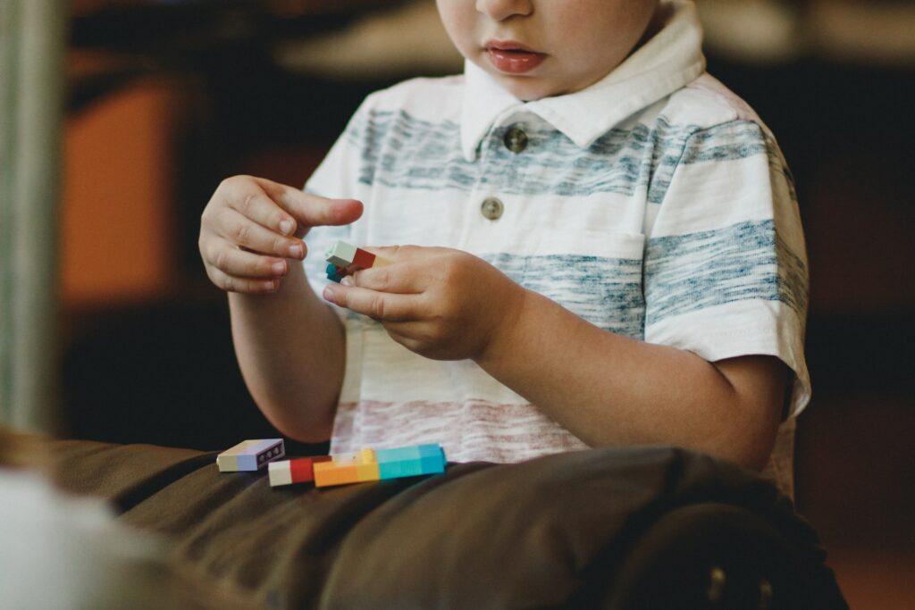 autism boy making something