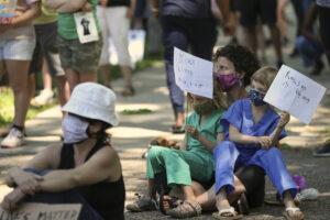 racial prejudice placards protest