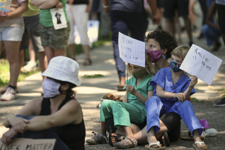 racial prejudice placards protest