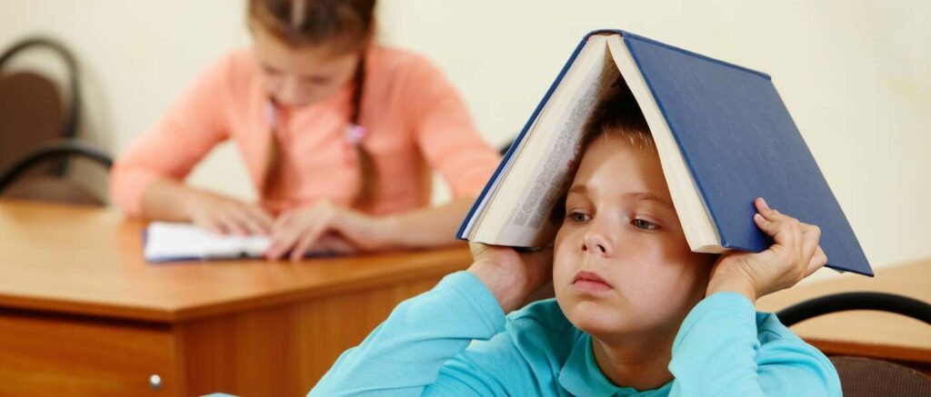 ADHD child book on head