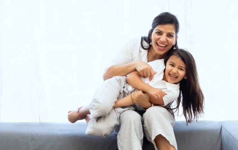 parenting mom holding child on lap