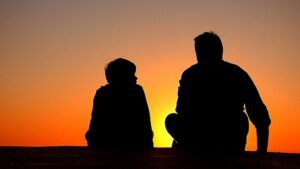 Discipline father and son sitting at night