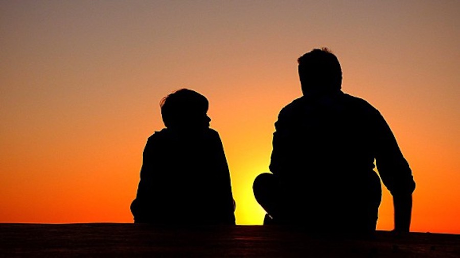 Discipline father and son sitting at night